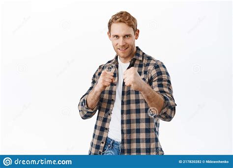 Daring And Confident Smiling Redhead Man Ready For Fight Holding Fists