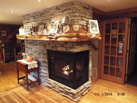 Fireplace Remodel With Two Sided Fireplace And Cedar Tree For Mantel