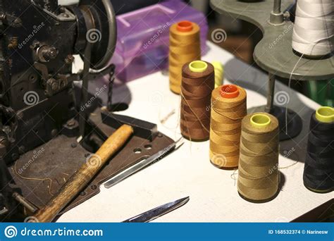 Polyester Sewing Thread Spool Placed On An Ancient Sewing Machine
