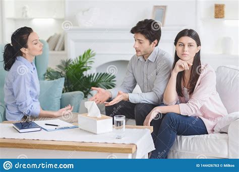 upset man talking to psychiatrist during couple counseling session stock image image of coach