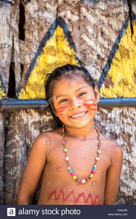 Native Brazilian Girl Smiling At An Indigenous Tribe In The Amazon