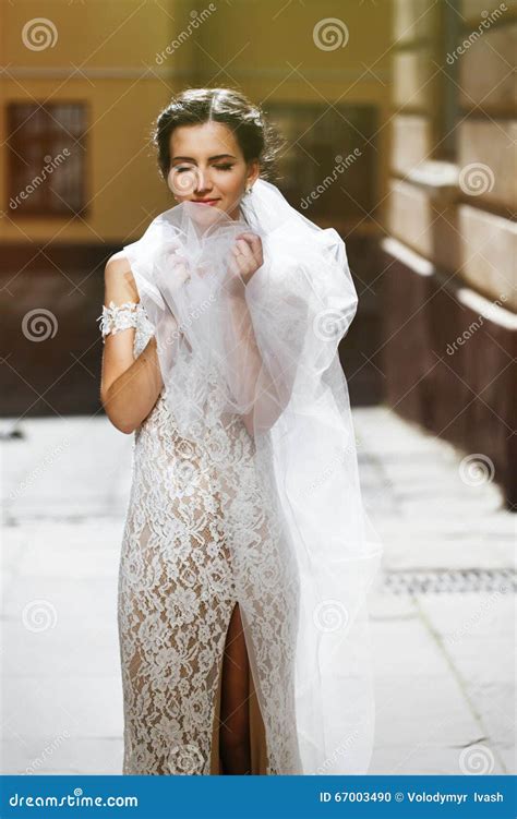 Gorgeous Happy Smiling Brunette Bride In Vintage White Dress Posing In