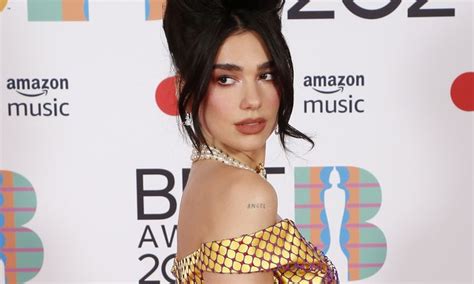 Dua Lipa Slays The Vacation Game In Pink Wrap Top And The Wildest Jeans