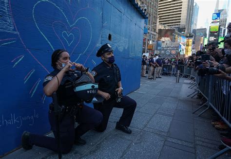 Police And Protesters Kneel Together And Hug Amid George Floyd Protests Access