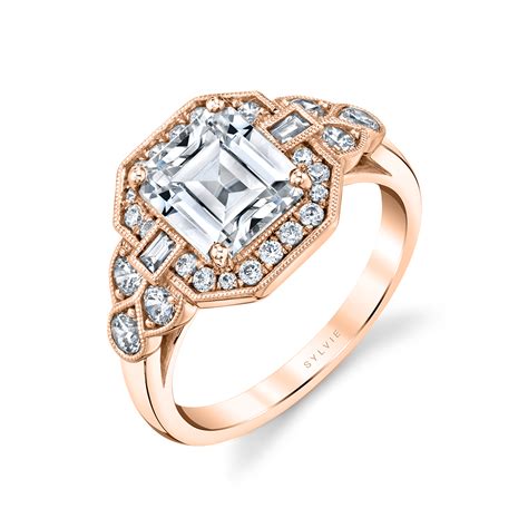 The pavé engagement ring style usually features this kind of stone setting along the band of the ring, with a larger stone placed centrally. Vintage Inspired Engagement Ring With Baguette - Francesca