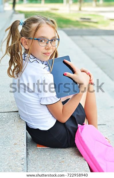 Photo De Stock Smiling Cute Schoolgirl Primary School Glasses 722958940