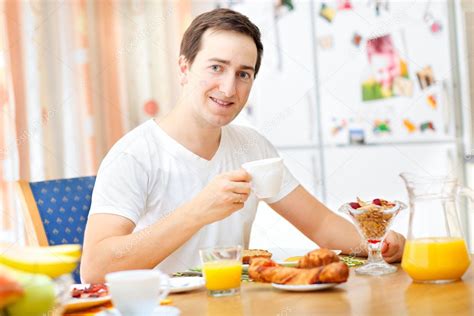 Man Having Breakfast Stock Photo By ©shalamov 4160957