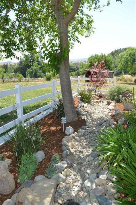 Create A Beautiful And Low Maintenance Garden Incorporating River Rock