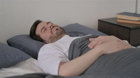 Young Man Sleeping In Bed Peacefully Stock Photo Image Of Tired