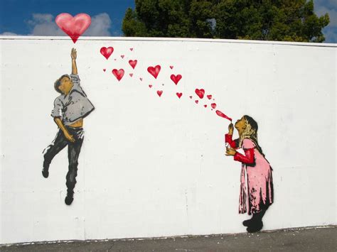 a woman holding a heart balloon in front of a wall with hearts drawn on it