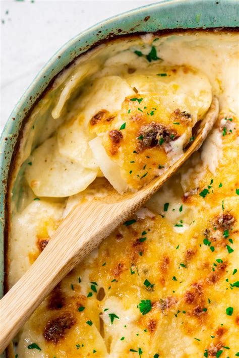 Scalloped Potatoes Baked With The Perfect Creamy Cheddar Cheese Sauce