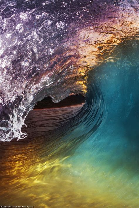 Photographer Andrew Cooney Captures Surfers Riding Through Rainbow