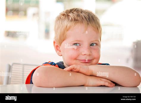 Mischievous Smiling Boy Stock Photo Alamy