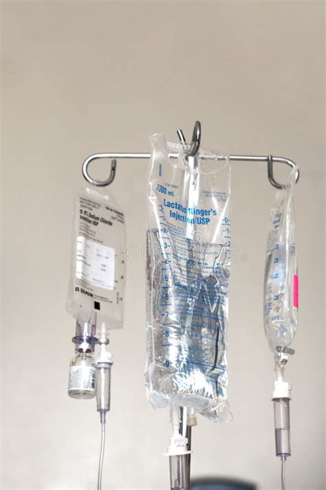 The Ivs Are Attached To The Wall In The Hospital Room With Medical