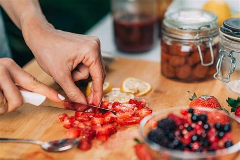 Premium Photo Cutting Strawberries In The Kitchen Fruit Fermentation