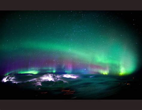 Lightning Lights Up Inside Some Clouds As The Northern Lights Cover The