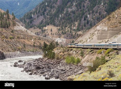 Passenger Train Travelling In The North Thompson River Canyon In