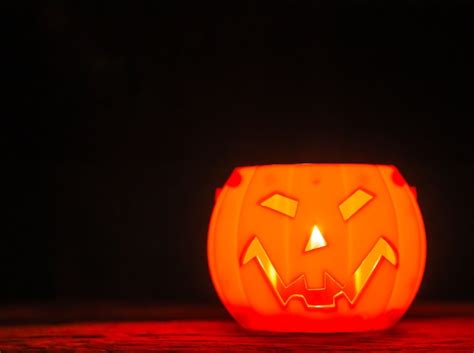 Premium Photo Halloween Pumpkin On Black Background Scary Smile