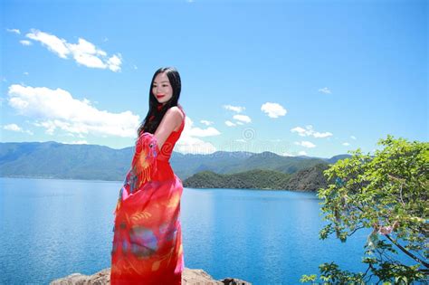Asian Chinese Beauty In Red Dress With Red Scraf On Head At Yunnan