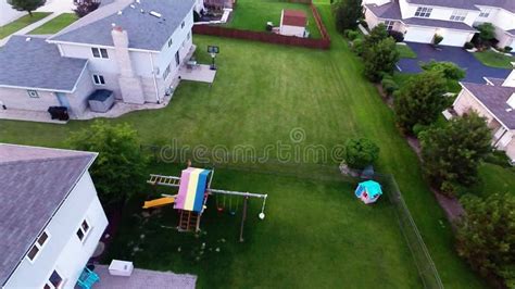 Aerial View Houses In Residential Suburban Neighborhood With Backyard
