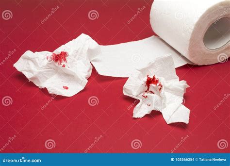 A Photo Of Used Of Bloody Toilet Paper And A Toilet Paper Roll On The
