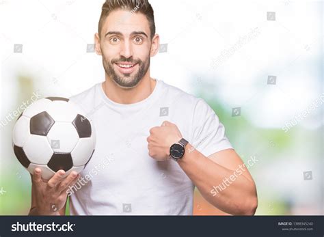 Young Man Holding Soccer Football Ball Stock Photo 1388345240