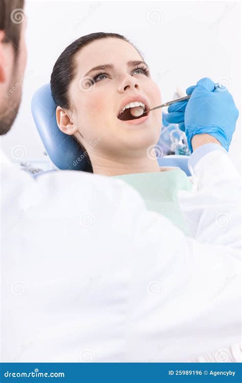 Dentist Examines The Oral Cavity Of The Patient Stock Photo Image Of