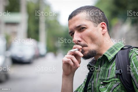 Portrait Of A Lonely Desperate Man Smoking Cigarette Stock Photo
