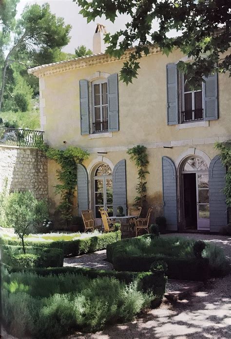 Front Facade Of French Country House With Provence Blue Shutters