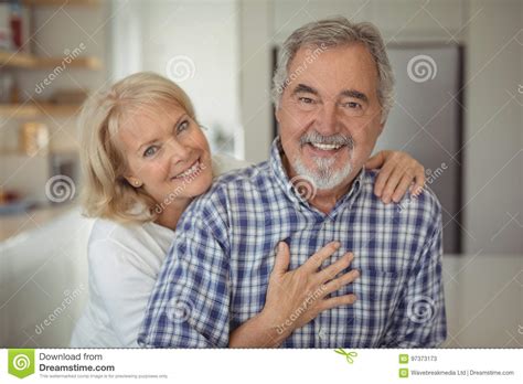 Senior Couple Hugging Each Other At Home Stock Image Image Of Closeness Cheerful 97373173