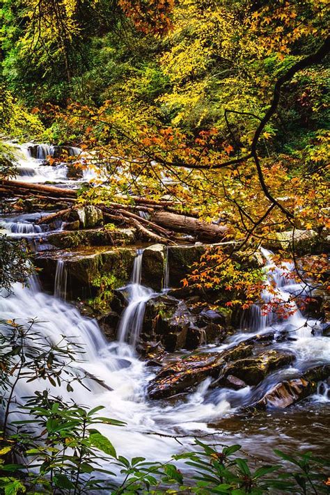 Cascades In Autumn Is A Photograph By Debra And Dave Vanderlaan