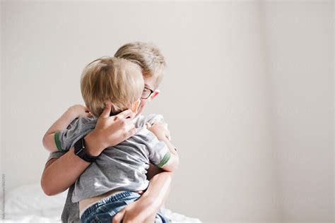 Big Brother Giving Little Brother A Hug By Stocksy Contributor Kelly Knox Stocksy