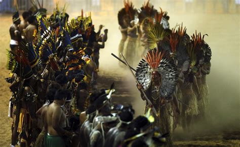 brazilian indigenous people dance as they attend the opening ceremony of the xii games of the