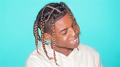 Travis Scott With Braids Out Travis Scott Is Known For His Music And