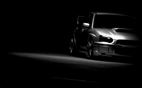 Download Sleek Black And White Car On The Road Wallpaper