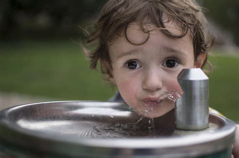 Thirsty Kid At The Water Fountain Rpics