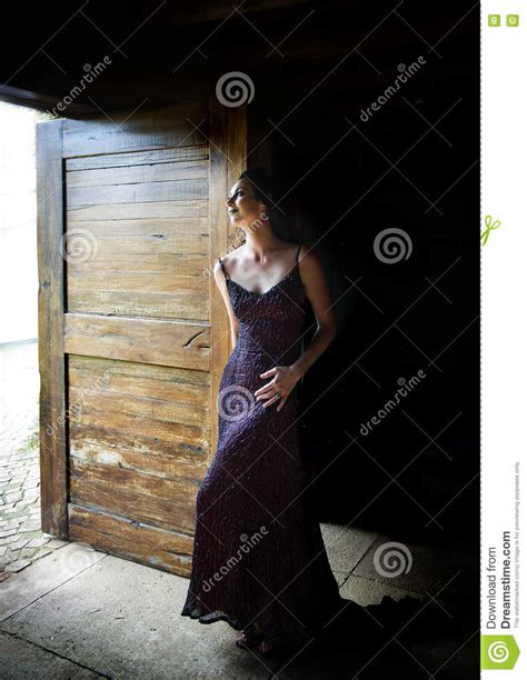 Woman In Red Evening Dress Standing In Doorway Stock Photo Image Of
