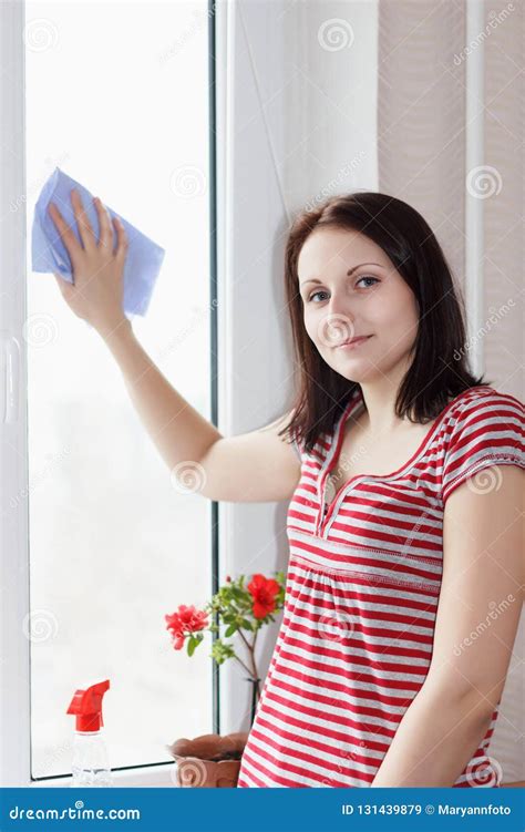 Careful Young Girl Washes And Cleans A Window Stock Image Image Of
