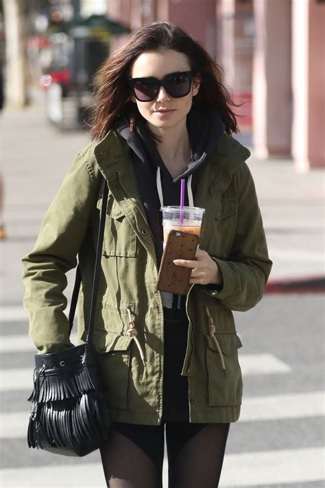 Lily Collins In Spandex Leaves The Gym With A Cold Drink West