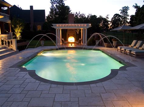 The laminar water jets by pentair water products can change color and enha. Night view of Roman Style Swimming Pool with Deck Jets ...