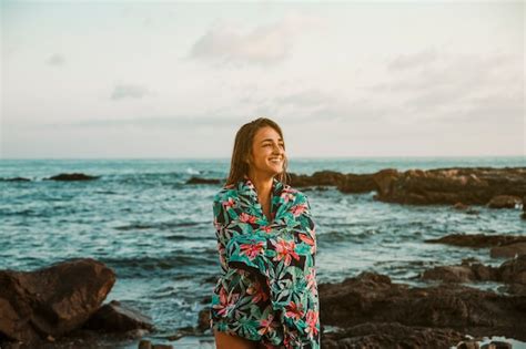 Free Photo Happy Woman In Blanket Standing On Sea Shore