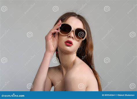 Portrait Of A Girl In Sunglasses In The Style Of Beauty Stock Photo