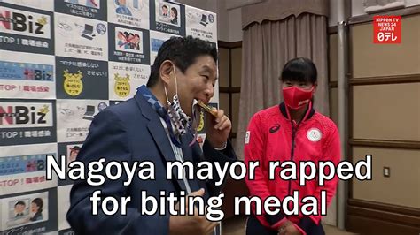 nagoya mayor rapped for biting tokyo olympian s medal youtube