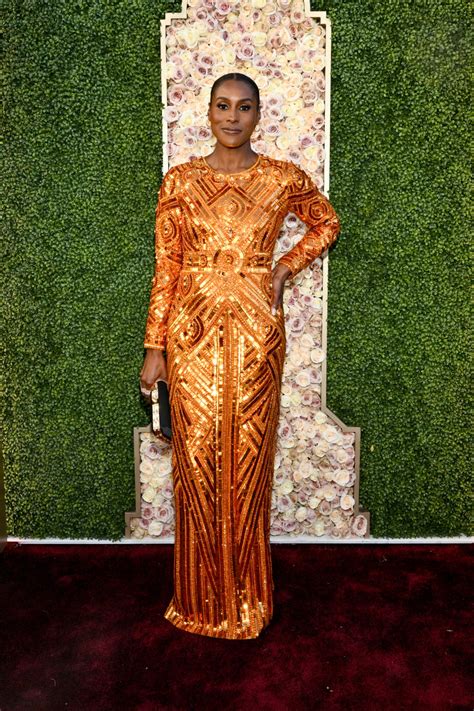 Issa Rae Goes For Gold In Pamella Rolland Gown At Golden Globes 2024