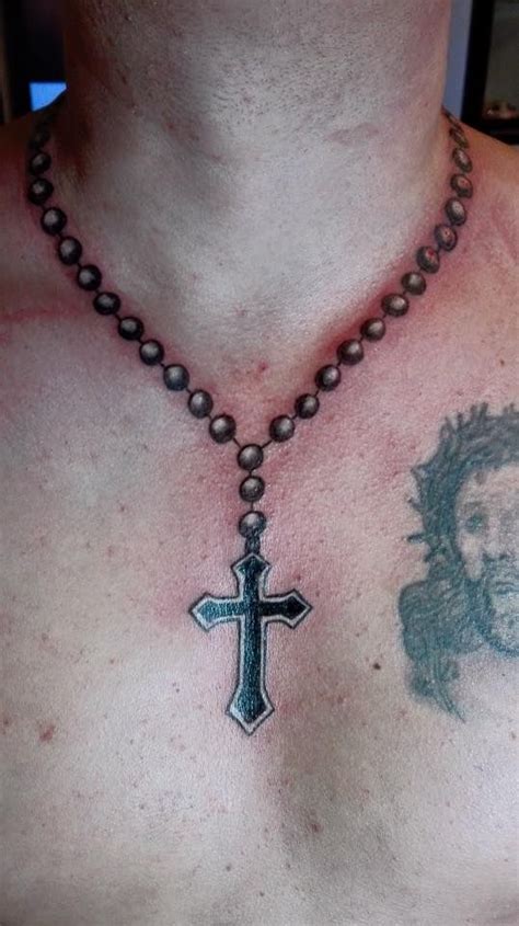 cross necklace chest tattoos