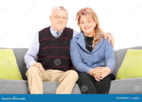 Mature Couple Posing Seated On A Couch Stock Image Image Of