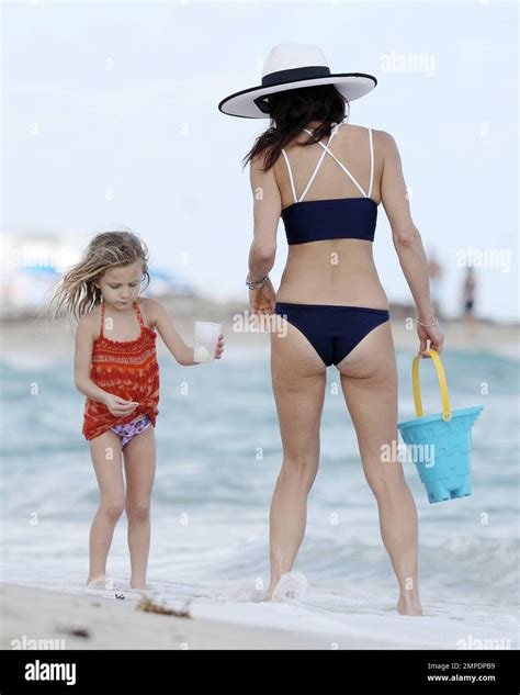 Bethenny Frankel Shows Off Her Slender Figure In A Navy Bikini And White Sun Hat As She Enjoys