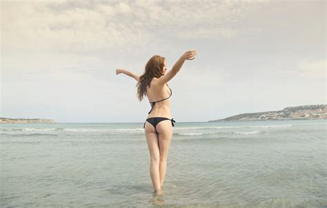 Free Photo Woman In Black Bikini Standing On Shore Beach Swimwear Sand Free Download Jooinn