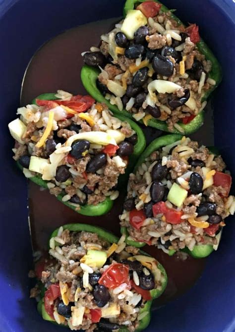 mexican stuffed peppers ~ bell peppers filled with seasoned ground beef rice and beans topped
