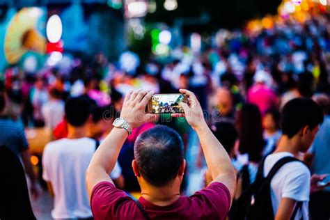 People Taking Photos Of Crowds With Mobile Phone Editorial Photo